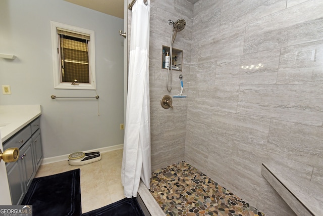 bathroom with vanity, a shower with curtain, and tile patterned floors