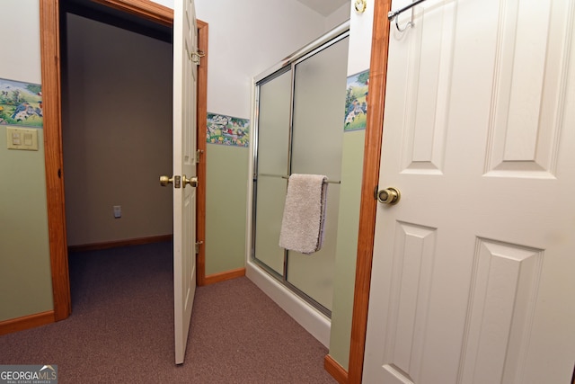 bathroom featuring an enclosed shower