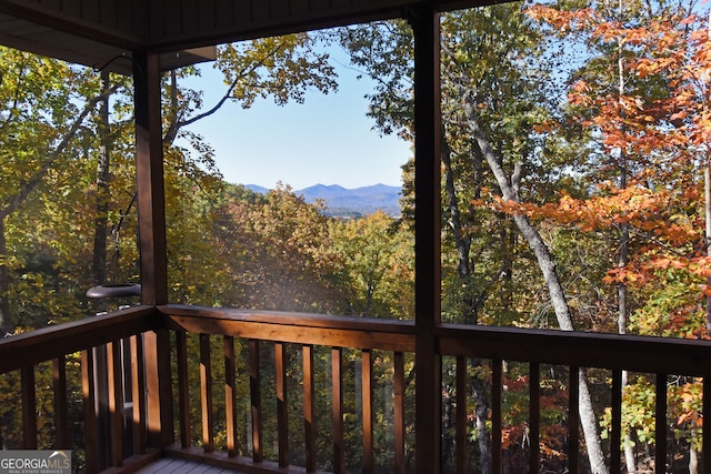 wooden deck with a mountain view