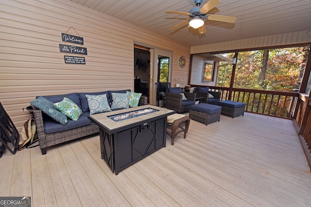 sunroom / solarium featuring wooden ceiling and ceiling fan