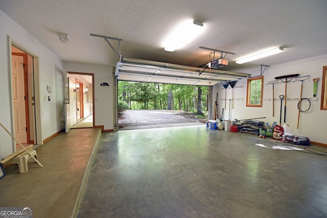 garage featuring a carport and a garage door opener