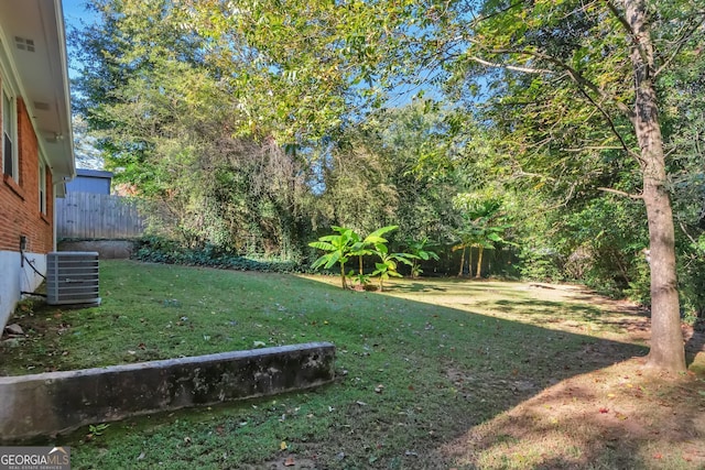 view of yard with central AC unit