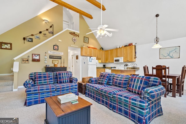 living room featuring light colored carpet, high vaulted ceiling, ceiling fan, and beam ceiling