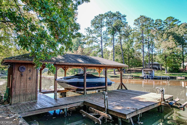 dock area with a water view