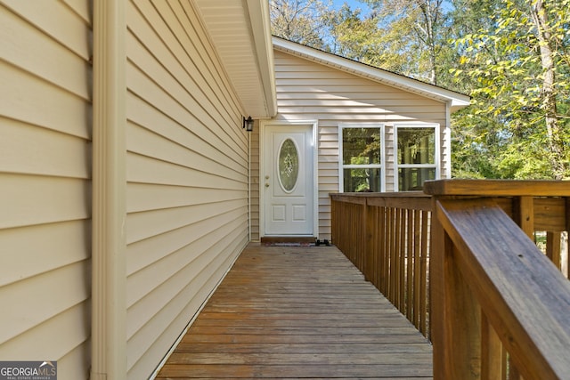 view of exterior entry with a deck