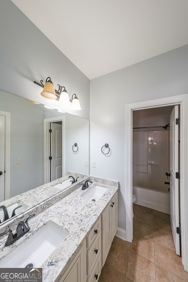 full bathroom with tile patterned floors, vanity, toilet, and shower / washtub combination