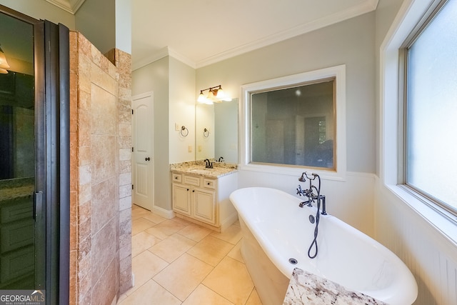 bathroom with tile patterned floors, a tub, vanity, and ornamental molding