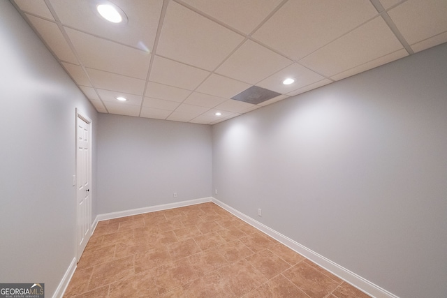 empty room with a drop ceiling