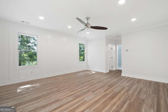spare room with recessed lighting, a ceiling fan, visible vents, and light wood-style flooring