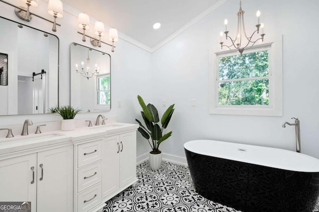 bathroom with vanity, crown molding, a tub to relax in, and tile patterned floors