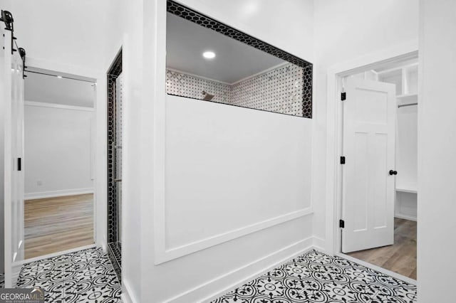 interior space featuring tile patterned floors and baseboards