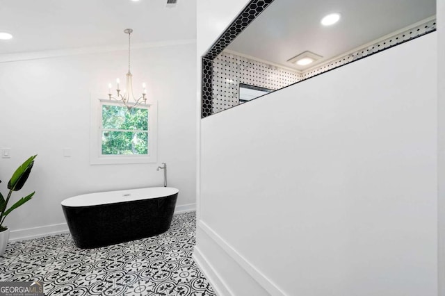 full bath featuring recessed lighting, tile patterned floors, a chandelier, a freestanding tub, and baseboards
