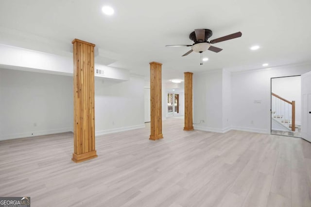 basement featuring light hardwood / wood-style floors, ornamental molding, and ceiling fan