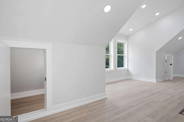 bonus room with recessed lighting, wood finished floors, lofted ceiling, and baseboards