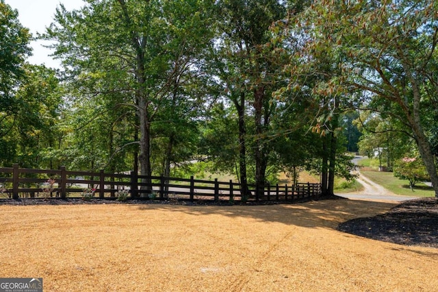view of home's community with fence