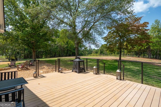wooden deck with fence and a yard