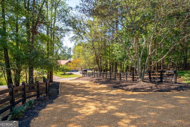 view of property's community featuring fence