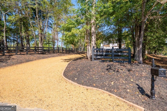 view of property's community with fence