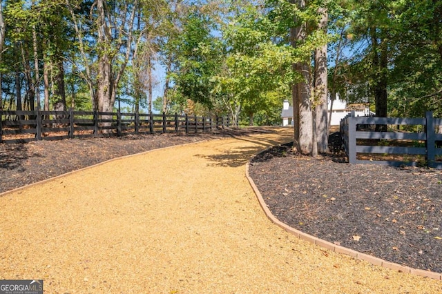 view of property's community featuring fence
