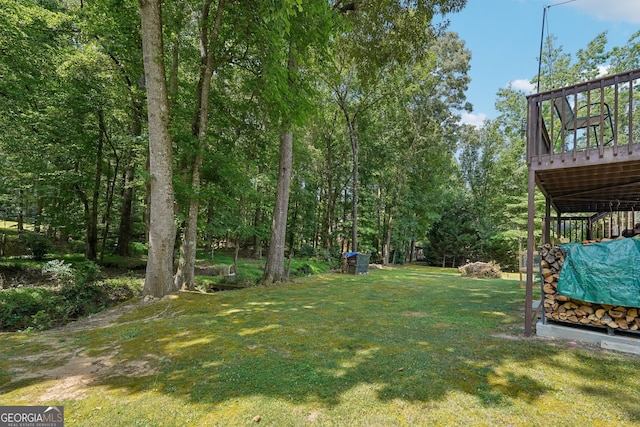 view of yard featuring a wooden deck