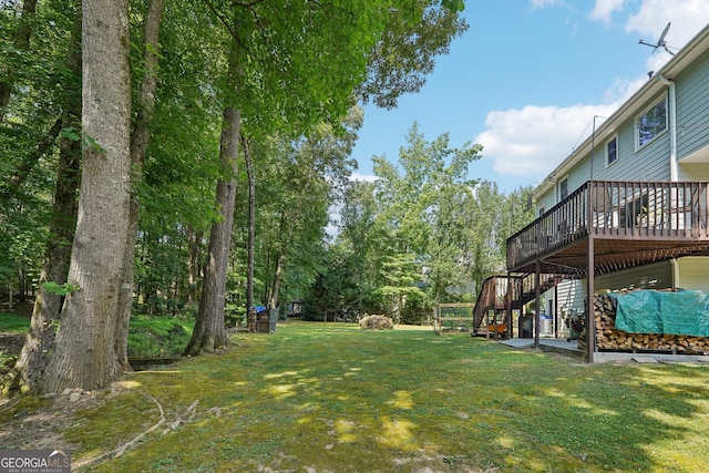 view of yard with a wooden deck