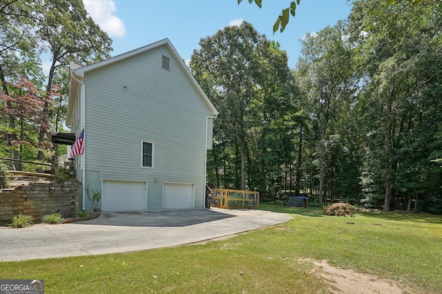 view of property exterior featuring a garage and a lawn