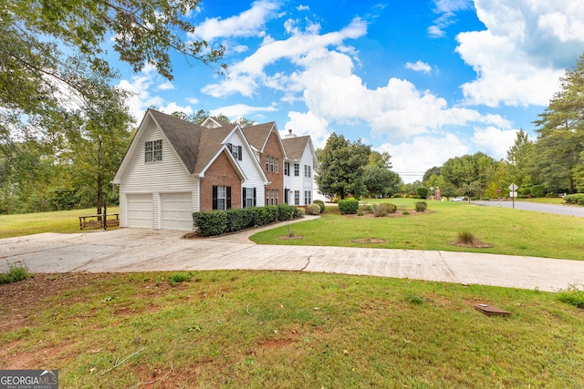 front facade featuring a front yard and a garage