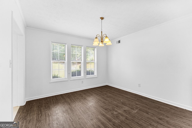 unfurnished room with a notable chandelier, dark hardwood / wood-style floors, a textured ceiling, and crown molding