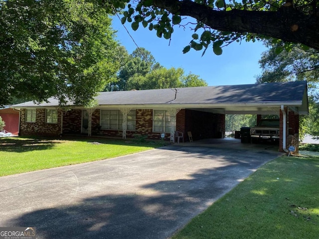 ranch-style house with a carport and a front yard