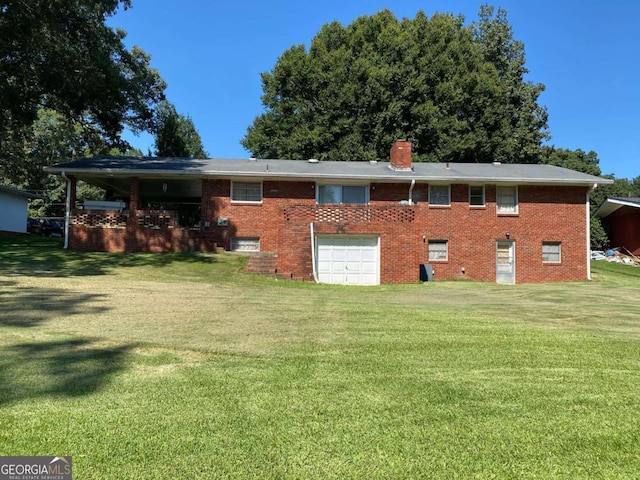 back of property with a lawn