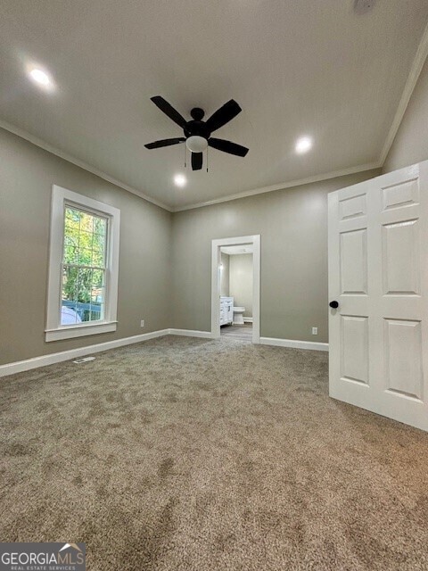17843 Main St, Woodbury, GA 30293 - carpeted empty room with ornamental molding, a textured ceiling, and ceiling fan