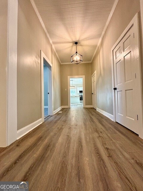 17843 Main St, Woodbury, GA 30293 - unfurnished room featuring crown molding, wood-type flooring, and a chandelier