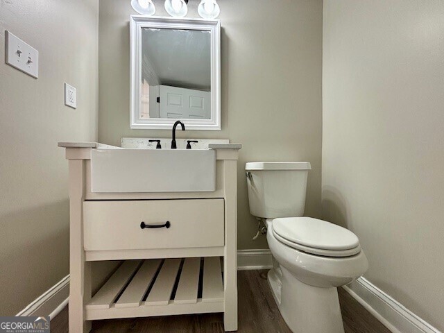 17843 Main St, Woodbury, GA 30293 - bathroom with toilet, hardwood / wood-style flooring, and vanity
