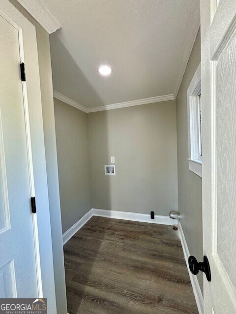 17843 Main St, Woodbury, GA 30293 - laundry room featuring hookup for a washing machine, wood-type flooring, and ornamental molding