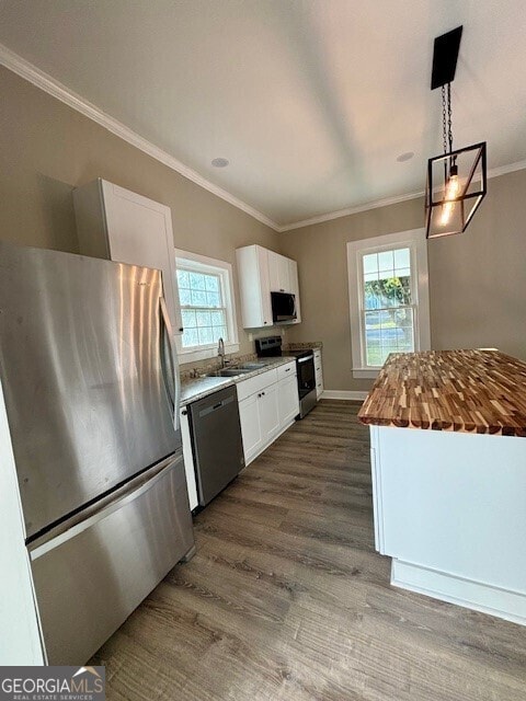 17843 Main St, Woodbury, GA 30293 - kitchen featuring hanging light fixtures, white cabinetry, dark hardwood / wood-style floors, butcher block counters, and stainless steel appliances