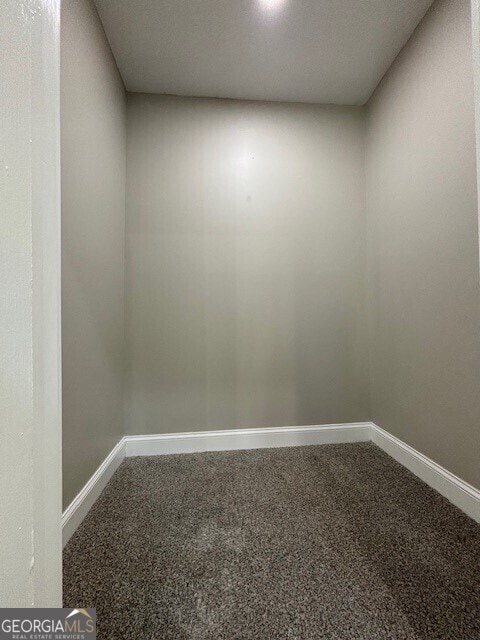 17843 Main St, Woodbury, GA 30293 - spare room with carpet flooring