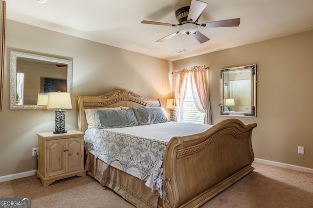 bedroom with light colored carpet and ceiling fan