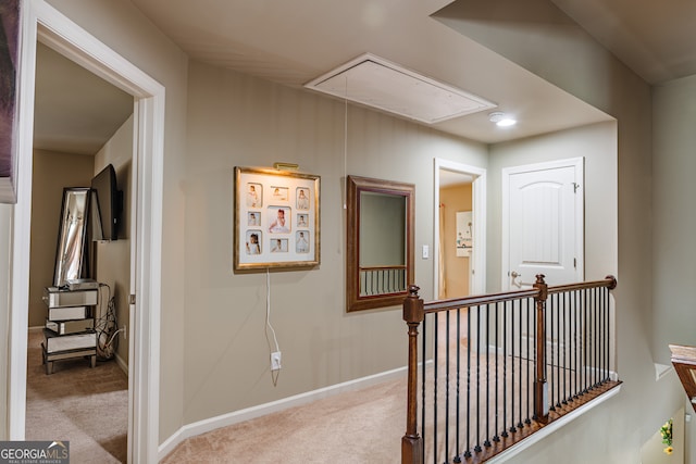 corridor with light colored carpet