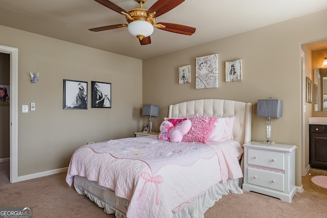 carpeted bedroom featuring connected bathroom and ceiling fan