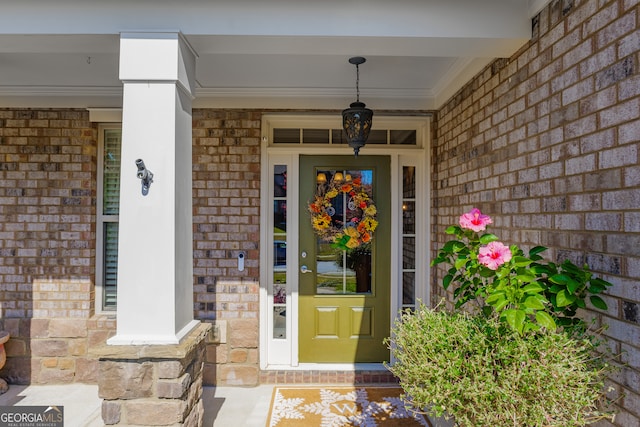 view of exterior entry featuring a porch