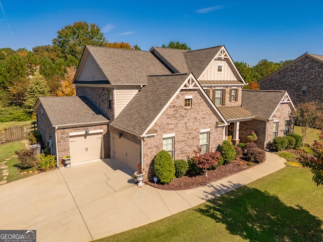 craftsman inspired home with a front lawn and a garage