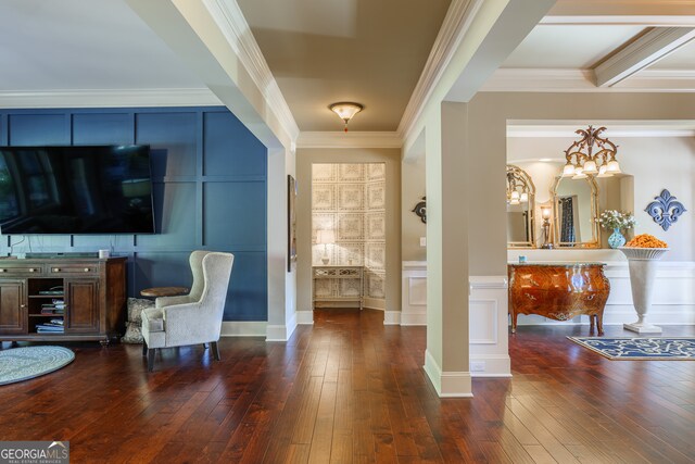 living area with crown molding and dark wood-type flooring