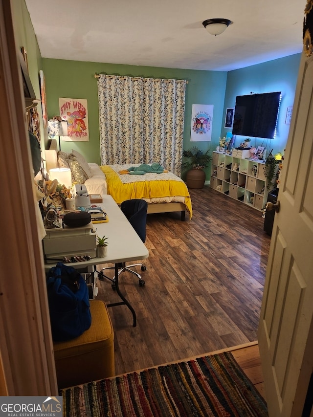 bedroom featuring hardwood / wood-style floors