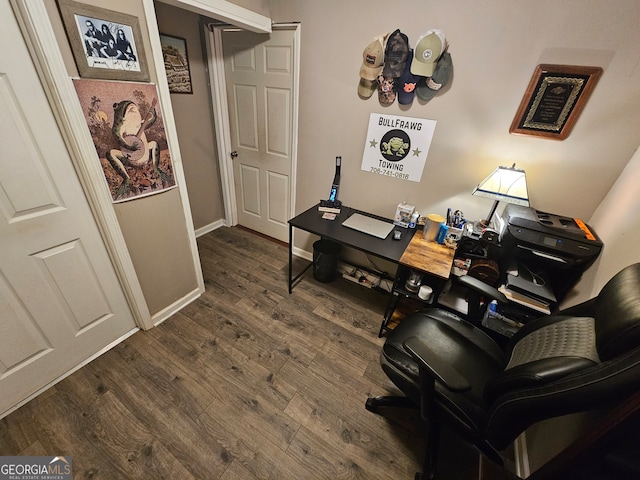 office space with dark hardwood / wood-style flooring