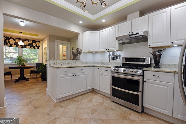 kitchen with white cabinetry, stainless steel range oven, and ornamental molding