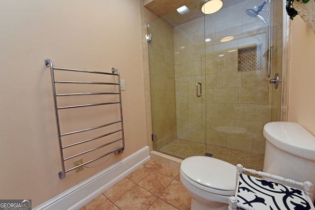 bathroom with toilet, radiator heating unit, a shower with shower door, and tile patterned flooring