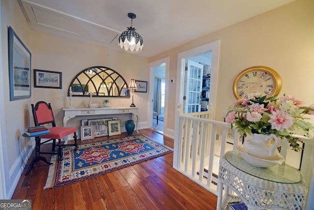 sitting room with dark hardwood / wood-style flooring