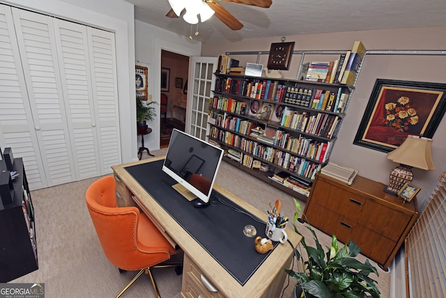 office area featuring ceiling fan and carpet