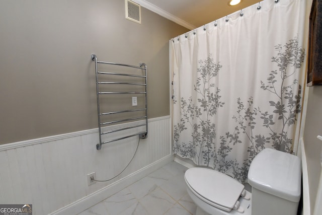 bathroom with ornamental molding, a shower with shower curtain, radiator heating unit, and toilet