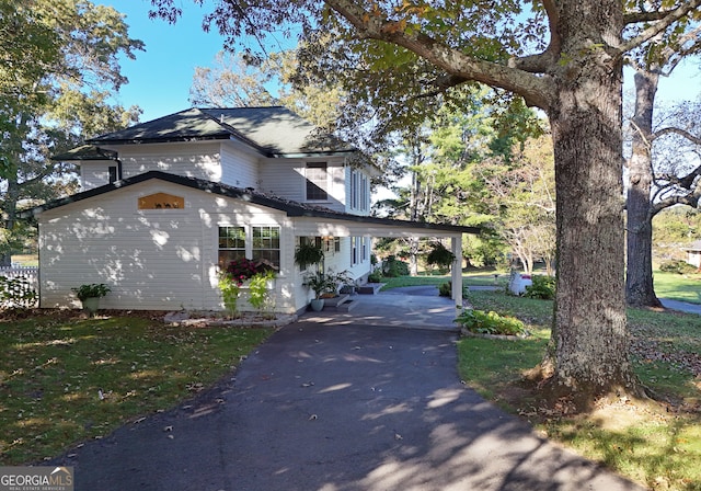 view of side of property featuring a carport